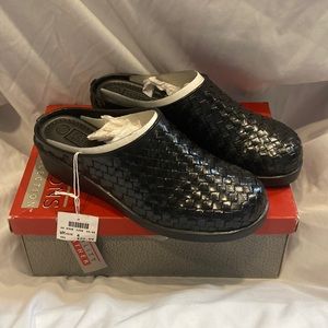 Slide on Black Mules: Predictions Leather Collection